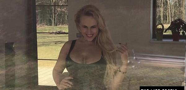  Girl with huge pierced boobs masturbates in front of a window cleaner.